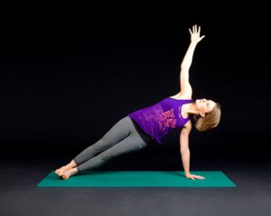 Side plank pose in yoga routine for weight loss